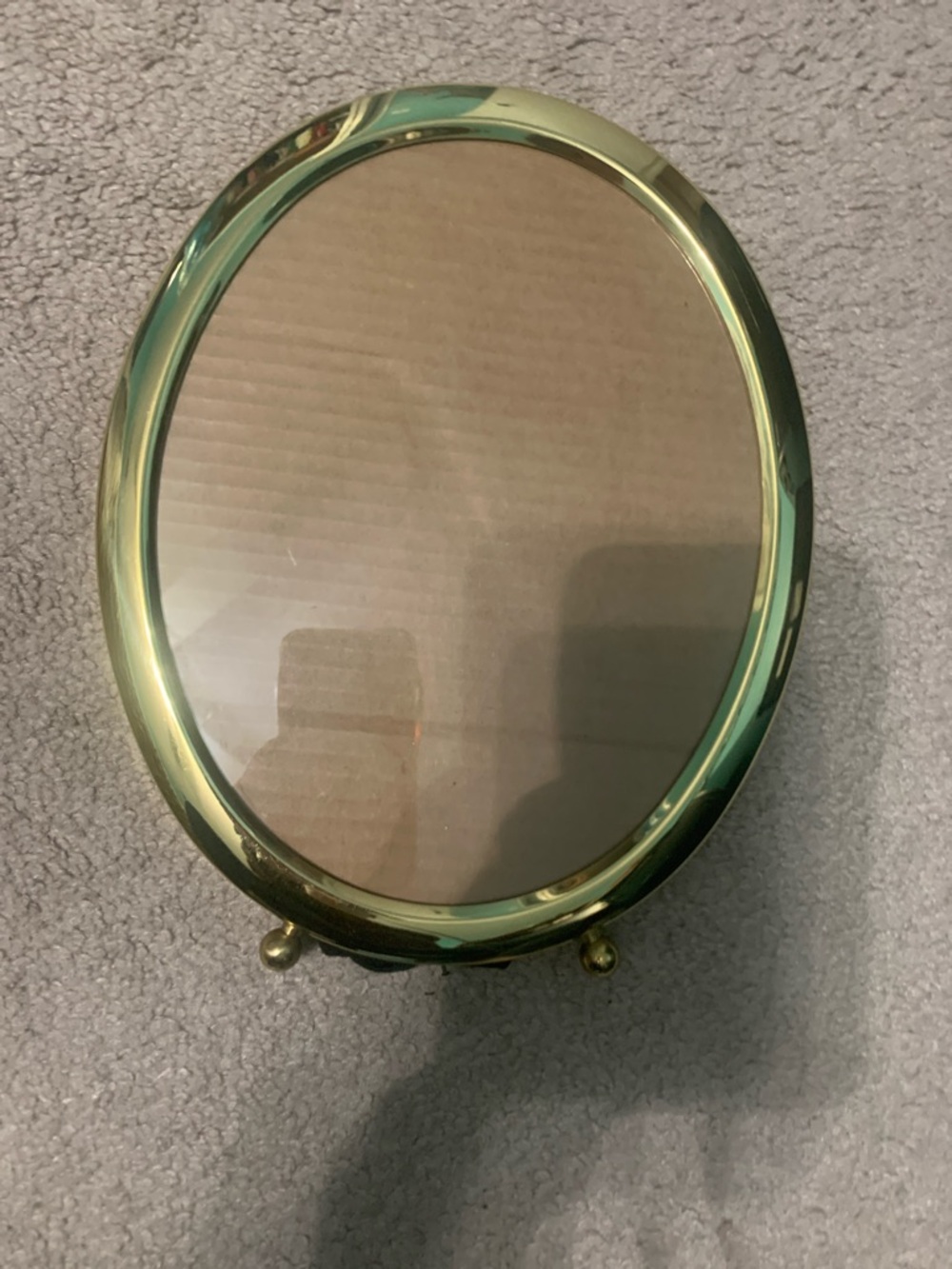 Oval polished brass picture frame. 8x10